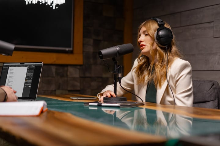 Podcaster Engages Her Audience In A Modern Studio Setting