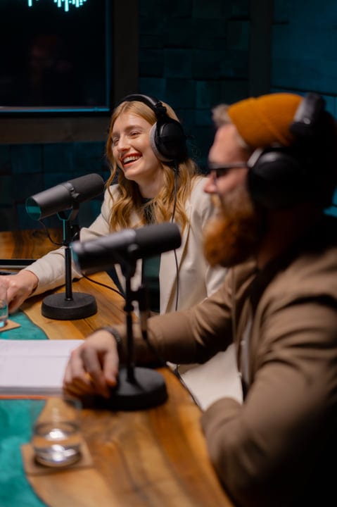 Candid Laughter Fills The Air In A Vibrant Podcast Studio