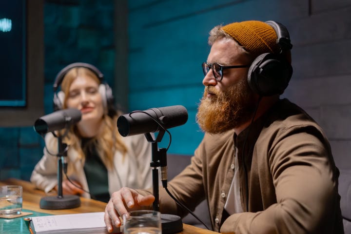 Podcast Hosts Engage in Energetic Studio Discussion