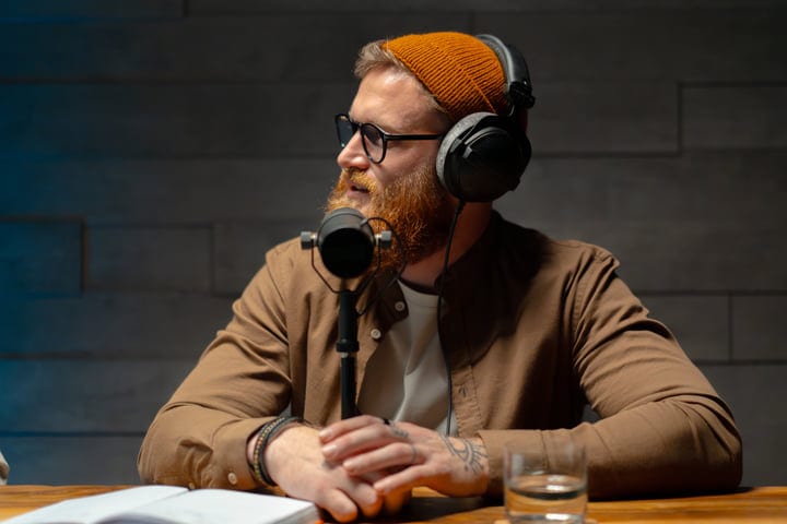 Bearded Host Engages Passionately In Studio Podcast Session