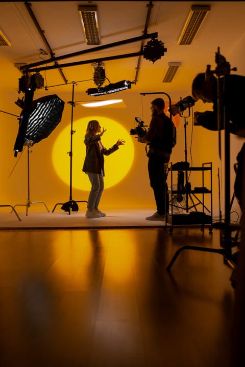Creative Dialogue In A Warmly Lit Photography Studio