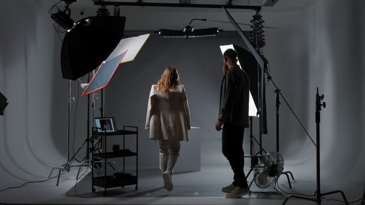 Creative Team Collaborates In Modern Photography Studio