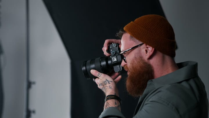 Focused Photographer Captures Art In A Studio Environment