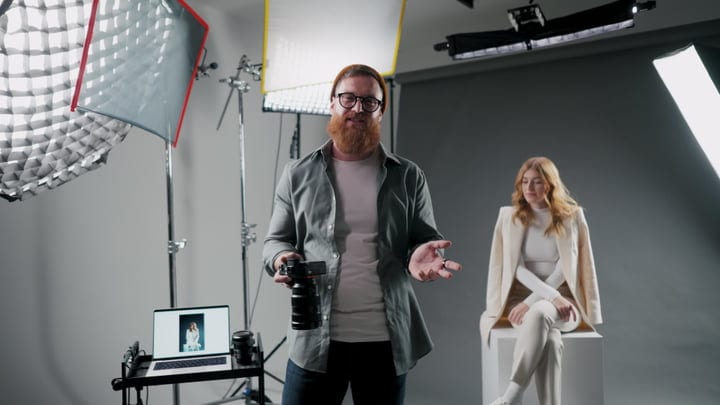 Creative Photographer Directing Model In High-Tech Studio