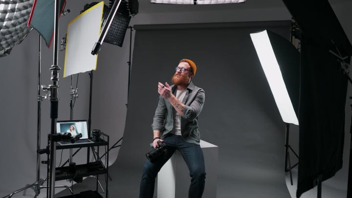 Dynamic Photographer Engages In Creative Studio Setup