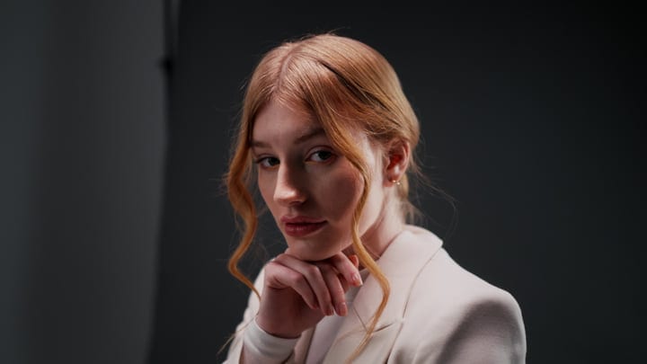 Contemplative Stare In A Minimalist Studio Portrait