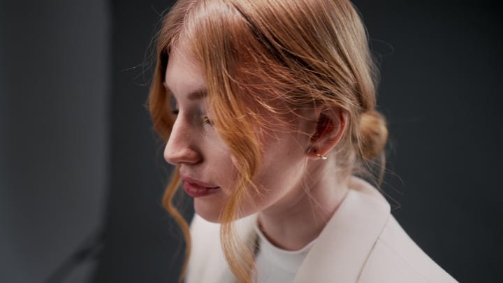 Contemplative Moment Captured In The Studio Spotlight
