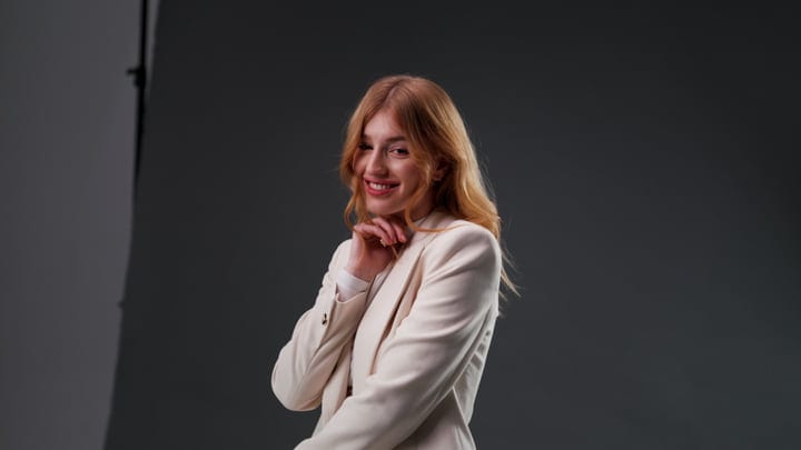 Confident Redhead Woman Smiling in Studio Portrait