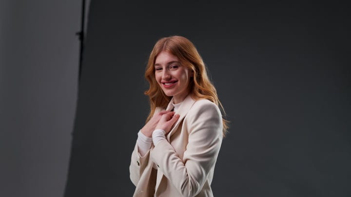 A Confident Woman Embraces Elegance In The Studio