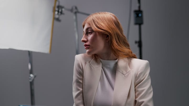 Thoughtful Moment In A Professional Photography Studio Setup