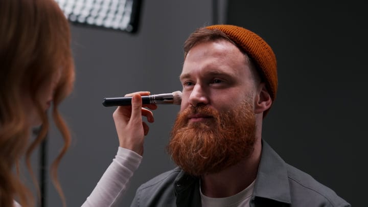 Bearded Model Prepares For A Studio Photo Shoot