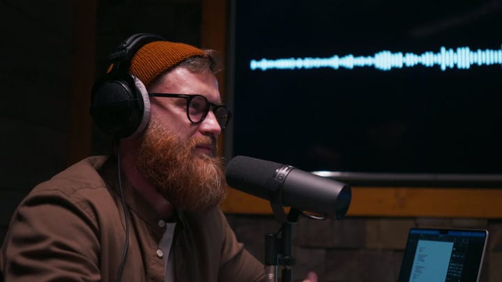 Podcaster In Deep Focus During Recording Session