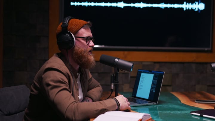 A Podcaster Immersed In Creative Studio Dialogue