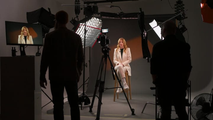 Professional Camera Setup Captures Portrait In Studio Ambiance