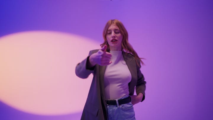Energetic Gesture Under Vibrant Studio Lighting