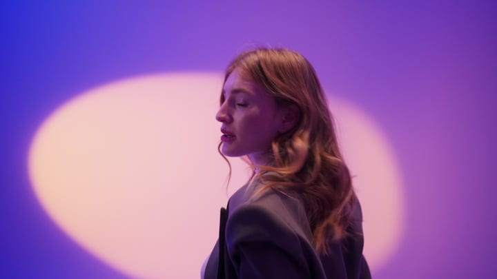 Dreamlike Studio Portrait With Soft Purple Lighting