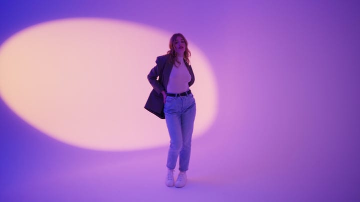 Confident Woman Poses Under Dreamy Studio Lights