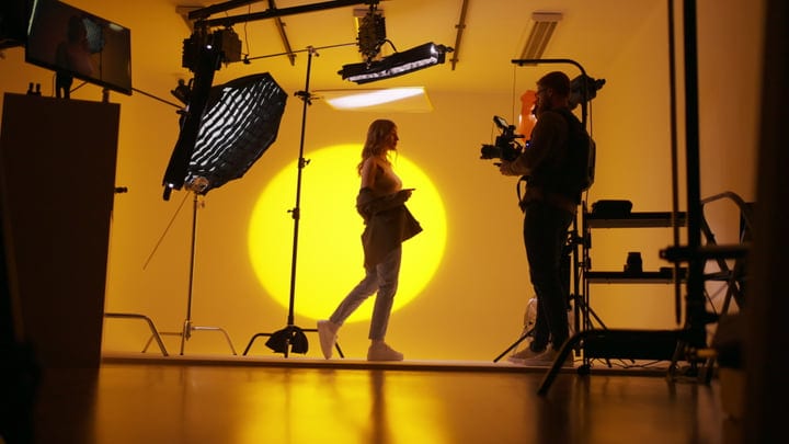 Creative Studio Session With Vibrant Yellow Backdrop
