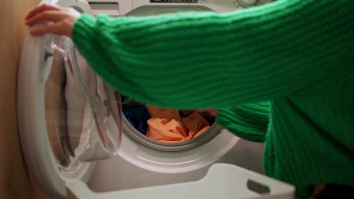 A Cozy Moment Folding Laundry In A Warm Home