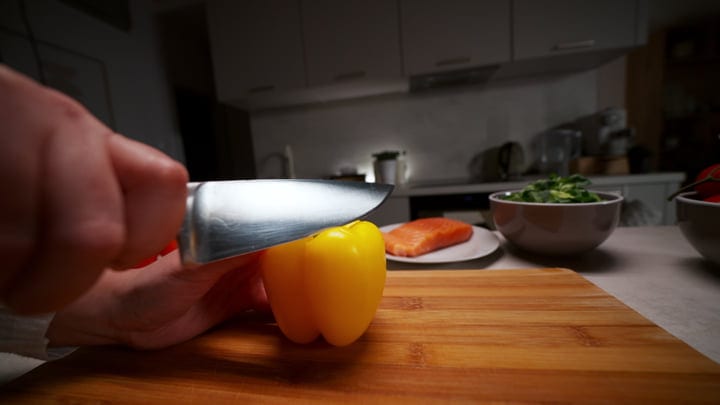 Preparing A Colorful Meal In A Cozy European Kitchen