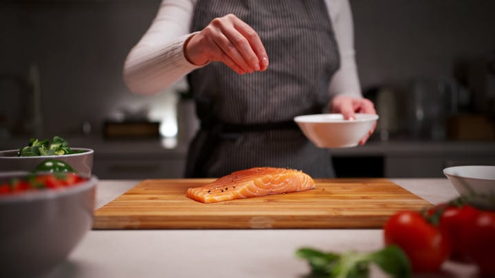 A Culinary Ritual: Seasoning Salmon With Precision