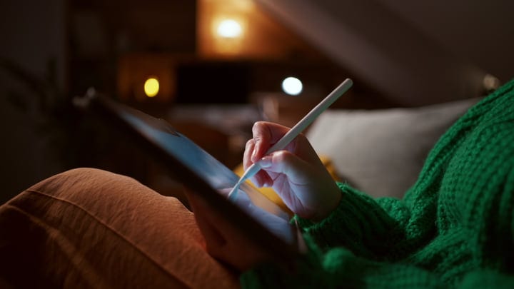 A Cozy Evening Creating Art On Her Tablet