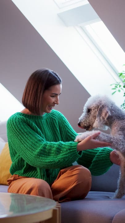 Joyful Moments With Her Furry Companion at Home