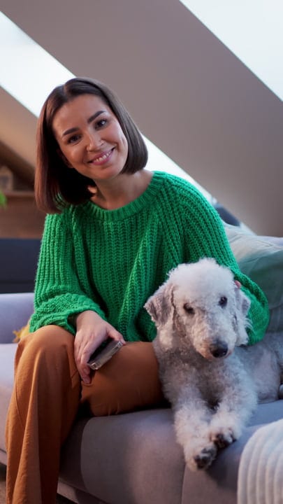 Cozy Moments With A Woman And Her Dog At Home