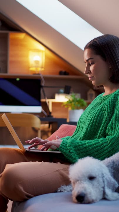 Woman Typing Peacefully in Cozy Home Setting
