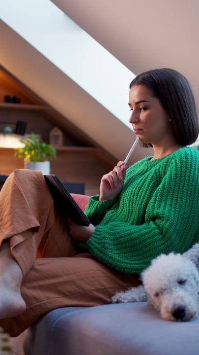 Thoughtful Woman Ponders Ideas In Cozy Attic Room