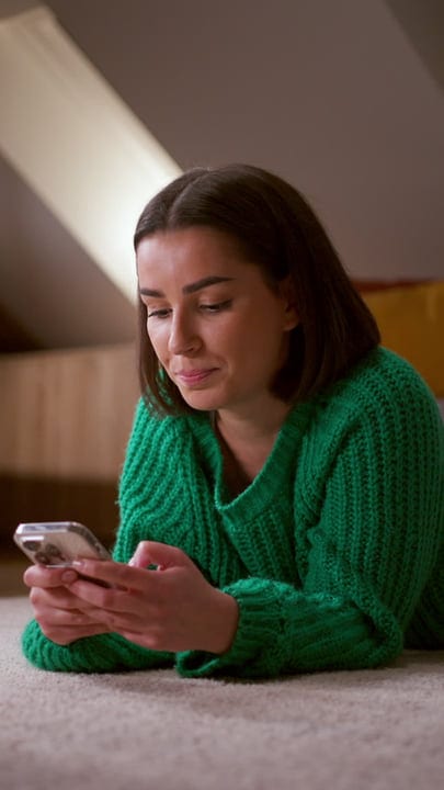 Cozy Moments With A Smartphone In A Sunlit Room