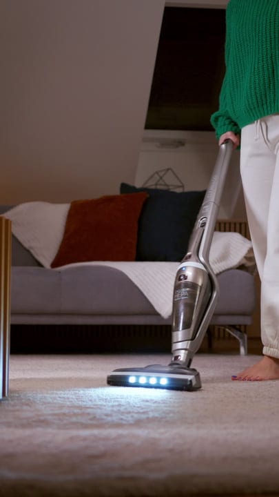 Evening Chores: A Woman Cleans Her Cozy Living Room