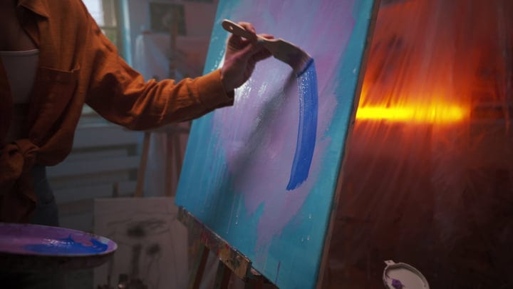 Vibrant Strokes Illuminate The Canvas In Warm Studio Light