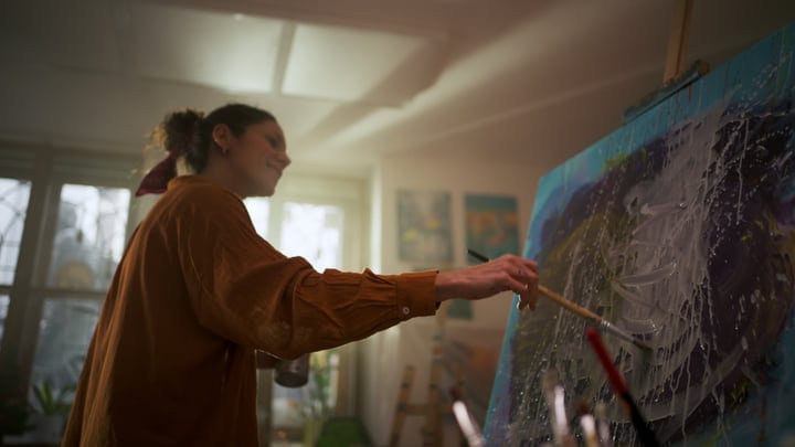 Focused Artist Immersed In Creative Studio Atmosphere