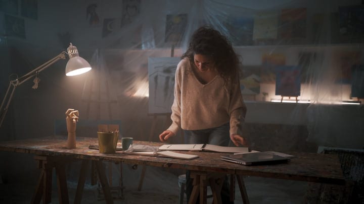 Artist Immersed In Creative Flow In Her Studio