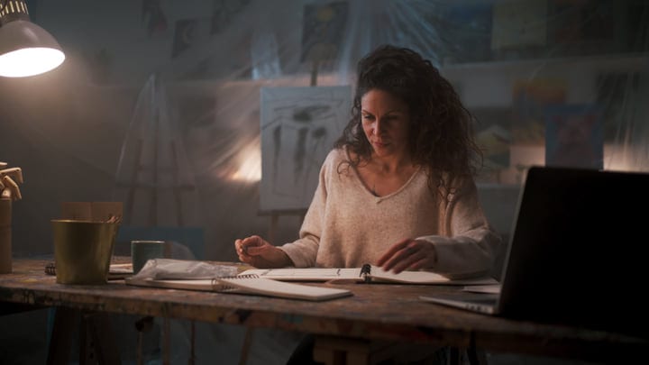 Focused Artist Sketches In Her Cozy Studio Atelier