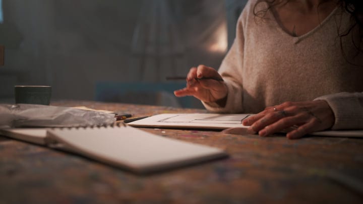 Gentle Hands Sketching In A Cozy Artist Studio