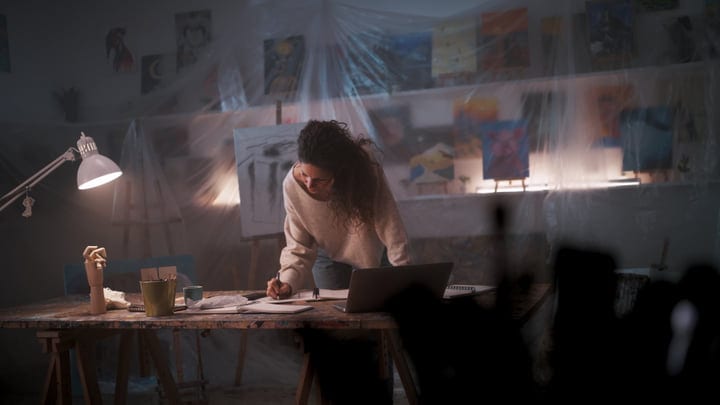 Artist Immersed In Creative Work In Her Studio