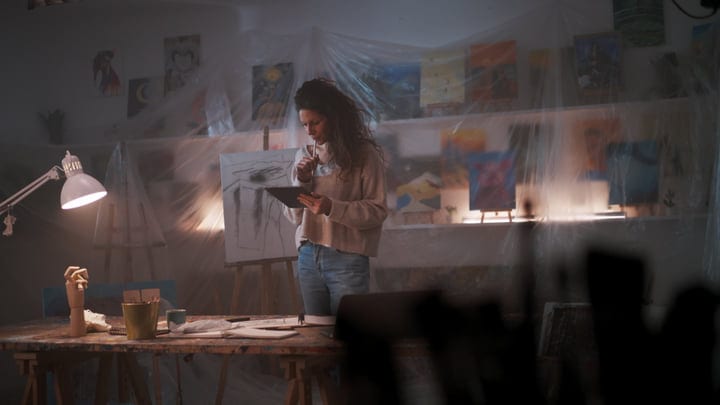 A Creative Mind Ponders In A Cozy Art Studio