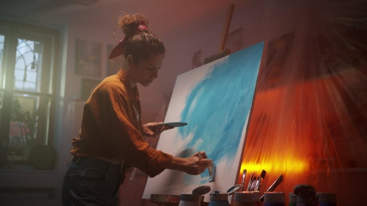 Creative Mind at Work in a Warmly Lit Studio
