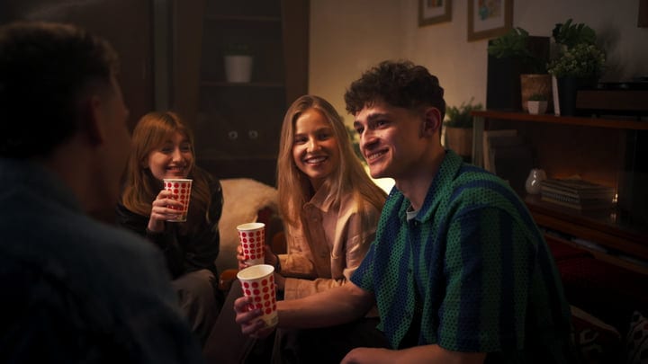Laughter Fills The Room During A Cozy Gathering