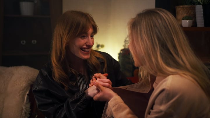 Laughter and Warmth Shared in a Cozy Living Room