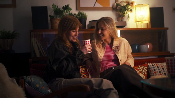 Warm Laughter Shared Over a Cozy Evening Drink