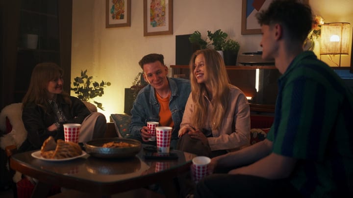 Warm Conversations Over Hot Cocoa In Cozy Living Room