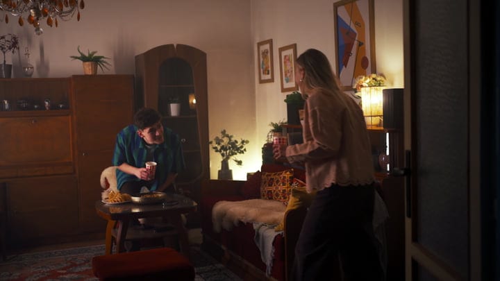 Warm Conversations Over Hot Drinks In Cozy Living Room