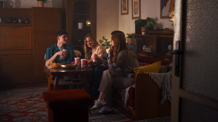 Laughter and Warmth Around a Cozy Living Room Table