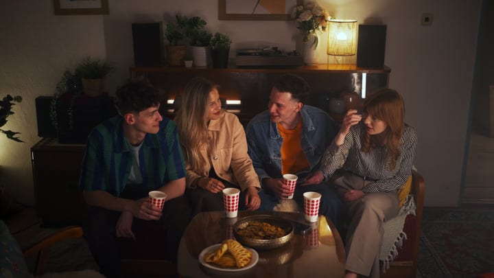 Laughter and Stories Shared Over Warm Drinks