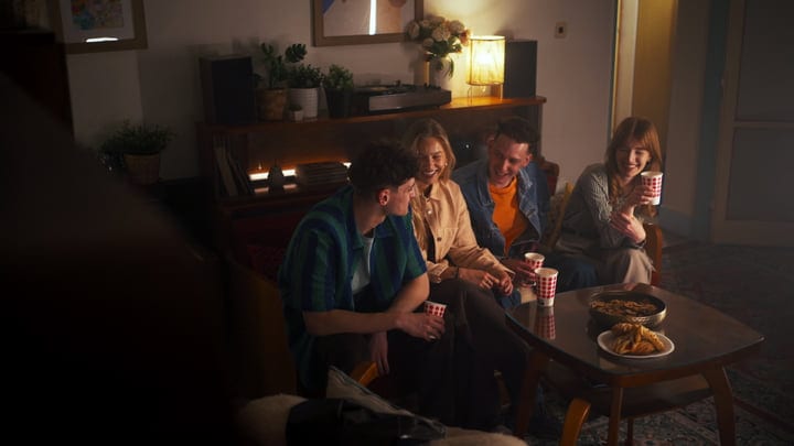 Laughter and Warmth at a Cozy Indoor Gathering