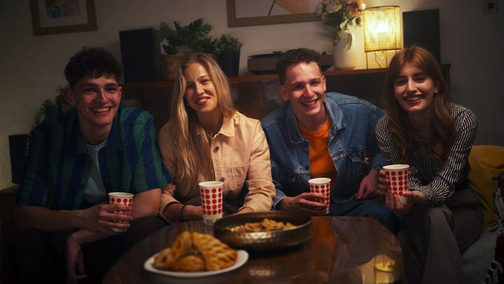 Laughter And Warmth In A Cozy Living Room Gathering