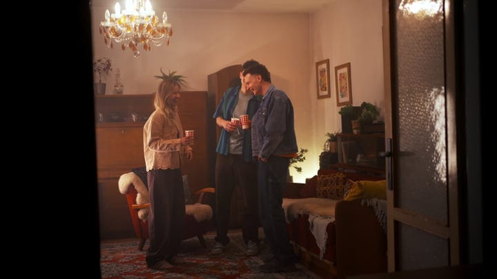 Warm Laughter Fills A Cozy Living Room Gathering